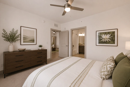 Bedroom with an adjoining bathroom at Millennium Apartments