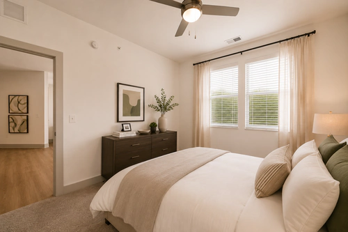 Bedroom with natural light at Millennium Apartments